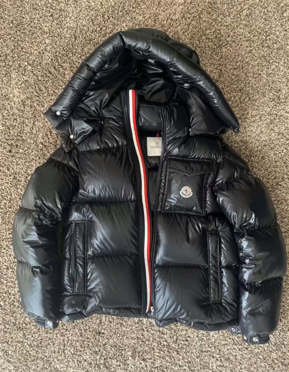 Black puffer jacket — before